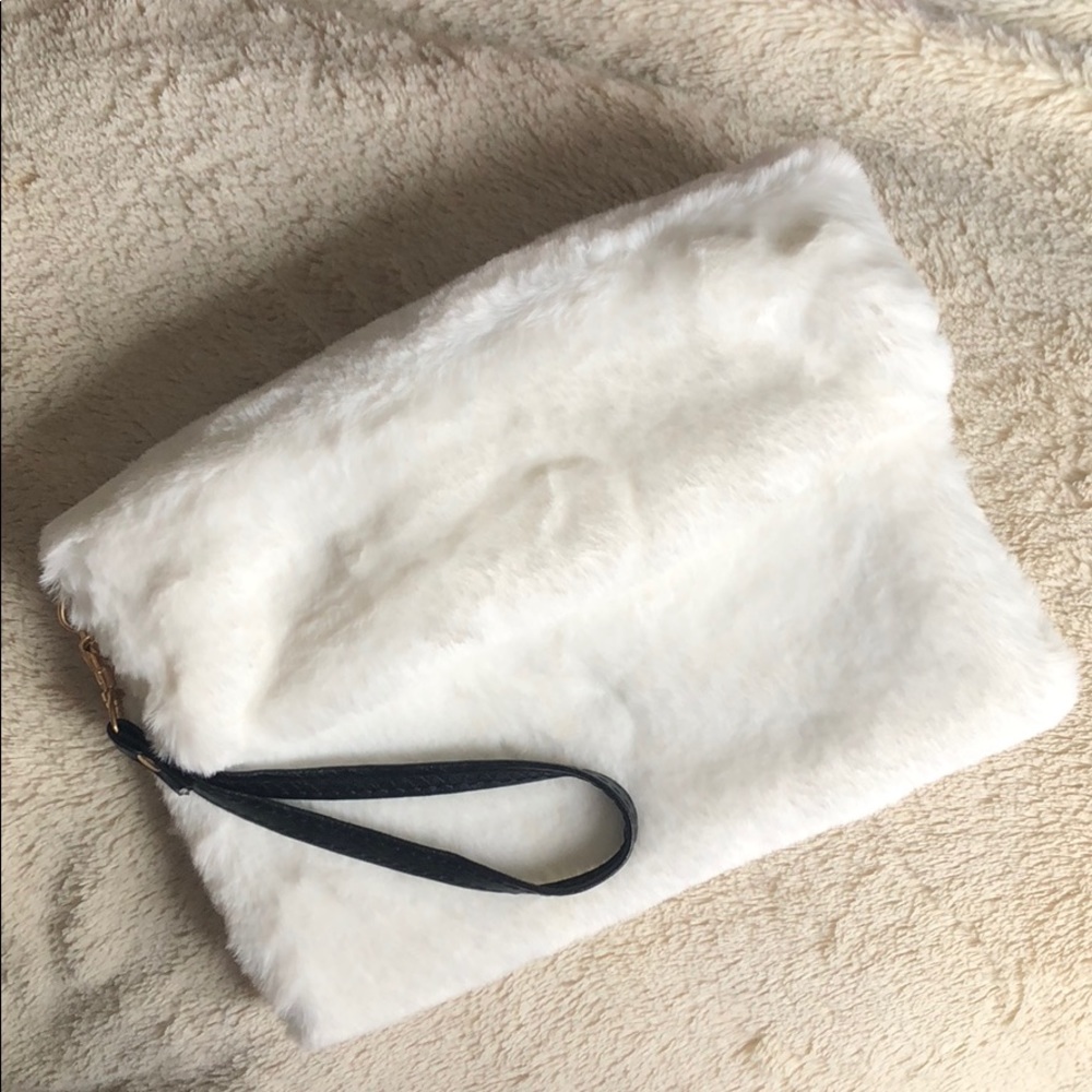 White faux fur fold over wristlet